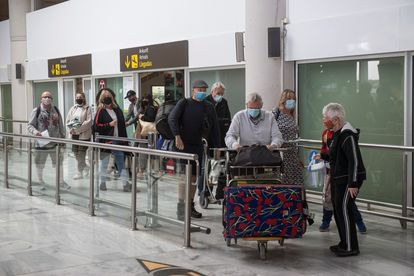 Tourists leave the arrivals zone at Lanzarote airport on October 24. 