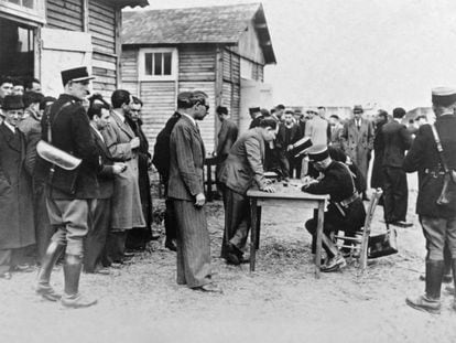 French policemen register foreign Jews in Pithiviers for their subsequent deportation, in May 1941.