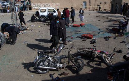 Explosives experts examine the site of one of Wednesday's attacks in Balochistan.