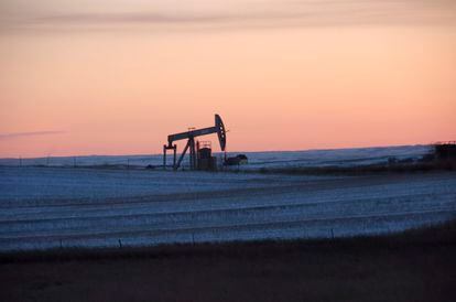 A pump jack for pulling oil from the ground is seen near New Town, N.D., Feb. 25, 2015. On Monday, March 27, 2023