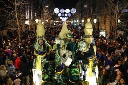 King Balthazar waves to the crowd during the Three Kings parade in Granada.