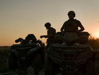 Ukrainian soldiers ride all-terrain vehicles at the front line near Bakhmut, one of the longest battles with Russian troops, Ukraine, Monday, Aug. 14, 2023