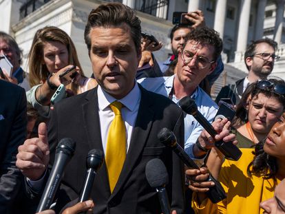 Republican Representative from Florida Matt Gaetz (C) responds to a question from the news media during a press briefing outside the US Capitol in Washington, DC, USA, 02 October 2023.