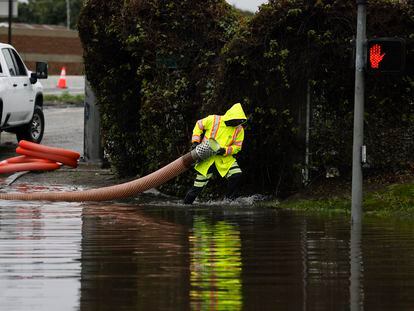 Crews work to drain a flooded area after an atmospheric river storm hit Long Beach, California, February 1 2024.
