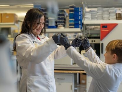 Researcher Diana Azzam with Logan Jenner, one of the participants in her study to identify the most precise drugs to treat childhood tumors.