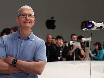 Tim Cook, executive president of Apple, poses alongside a model of the Apple Vision Pro glasses, after the product presentation at the Apple Worldwide Developers Conference on June 5.