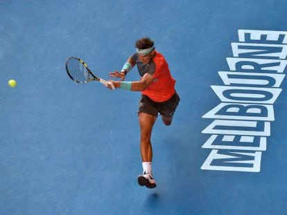 Rafa Nadal returns a shot during his battling win against Kei Nishikori. 