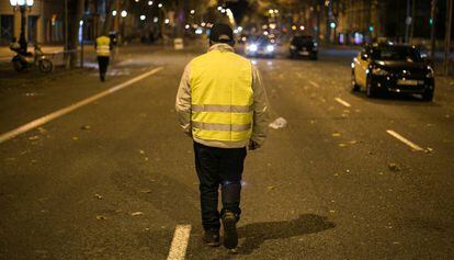 A taxi driver walks down Gran Via in Barcelona after the strike was called off.