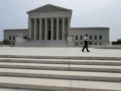 A police officer patrols outside the U.S. Supreme Court in Washington, June 30, 2023.