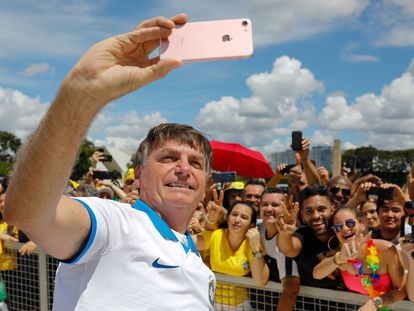 Jair Bolsonaro with supporters at a rally in Brasília on March 15, 2020.