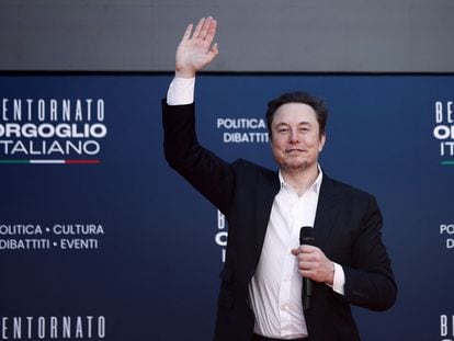 Elon Musk greets the audience at an event held by the fascist Brothers of Italy party in Rome, on Saturday, December 16, 2023.