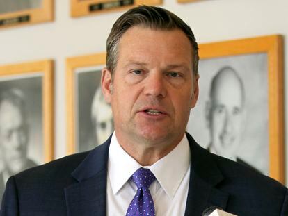 Kansas Attorney General Kris Kobach answers questions from reporters during a news conference outside his office May 1, 2023, in Topeka, Kan.