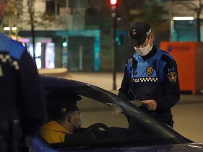 Police at a curfew checkpoint in the Catalan city of Terrassa on Sunday night.