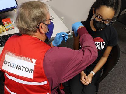 A child receives the Pfizer BioNTech Covid-19 vaccination at the Fairfax County Government Center on November 04, 2021 in Annandale, Virginia.