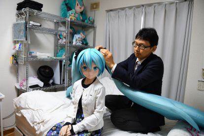 Akihiko Kondo at home in Tokyo with a life-size doll of Hatsune Miku, the virtual pop star he married in 2018