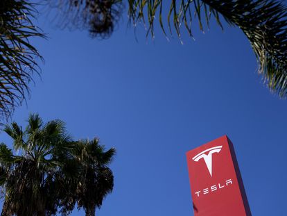 A Tesla sign is seen in Buena Park, California, USA, 01 December 2023.
