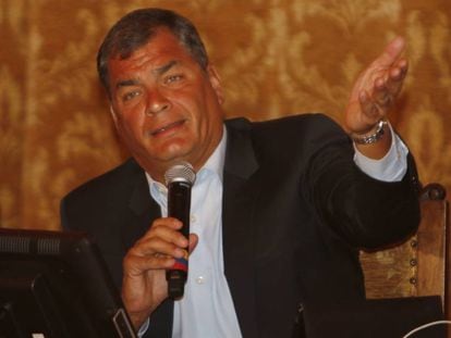 President Correa announces tax hikes at a press conference.