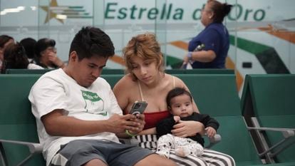 A family looks for buses after being evacuated from Acapulco.