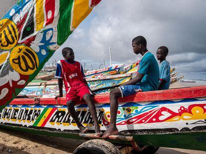 Children sit on a small boat in Fas Boye, Senegal, August 18.