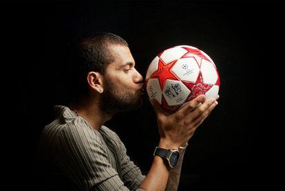 Dani Alves, who missed the 2009 Champions League final, poses with the official match ball for this year's showpiece at Wembley.