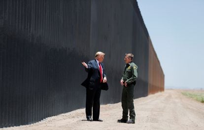 Then-US president Donald Trump with Border Patrol Chief Rodney Scott during a tour of a section of the US-Mexico border wall in San Luis, Arizona, June 23, 2020. 