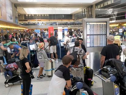 Travelers make their way through the Tom Bradley International Terminal at LAX
