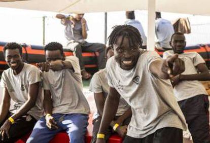 Migrants celebrating aboard the Open Arms ship.