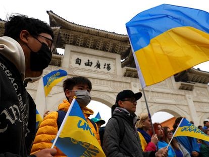 Protesters with Ukrainian flags at a rally in Taipei on February 25 to mark the first anniversary of the war.