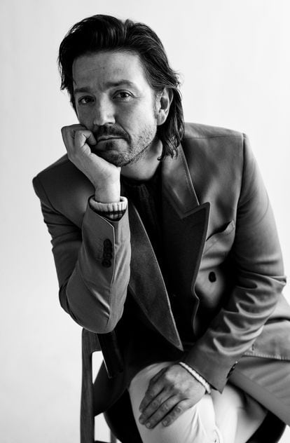 The Mexican actor wears an Etro sweater and jacket.