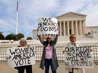 Three women protested before the Supreme Court on November 2.