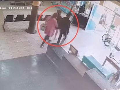 Fanny Hurtado Altamirano holds a baby while being treated by hospital staff, in an image captured by security cameras on September 4.
