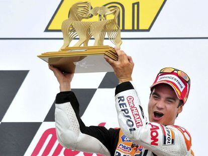 Dani Pedrosa celebrates on the podium after winning the German MotoGP at the Sachsenring.