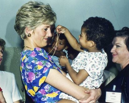 The Princess of Wales focused on charity work, helping sick, at-risk and wounded children in numerous countries such as India, Pakistan and New Zealand. Above, with an HIV-positive baby in São Paulo, Brazil, in April 1991.