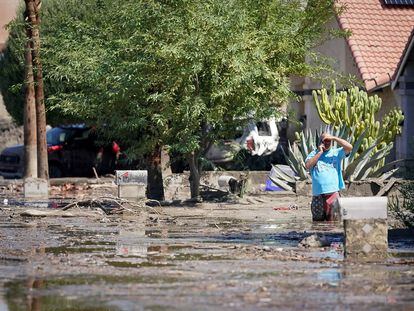 A man surveys the damage in his front yard following Tropical Storm Hilary in Cathedral City, California, U.S., August 21, 2023.