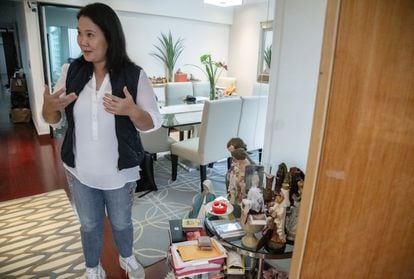 Fujimori by an altar in her apartment in Lima.