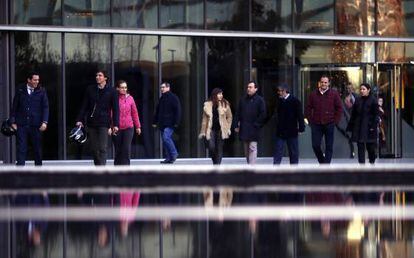 Employees leave work in the early afternoon at Iberdrola in Madrid.