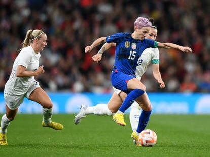 USA's Megan Rapinoe marshalled by England's Lucy Bronze and Beth Mead in a friendly last year.