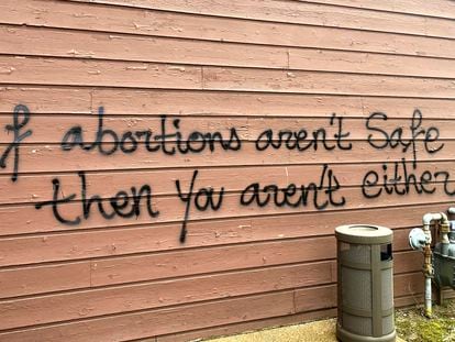 Threatening graffiti is seen on the exterior of Wisconsin Family Action offices in Madison, Wisconsin, on May 8, 2022.