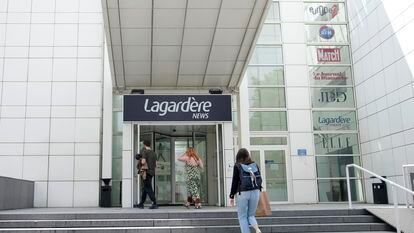 People enter the Lagardere News headquarters Tuesday, Aug. 1, 2023 in Paris.
