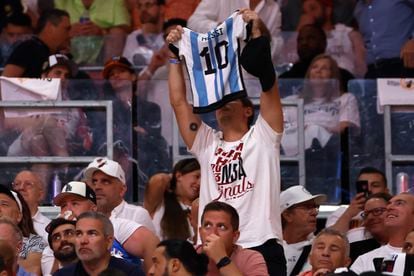 A fan holds up a Messi jersey during the NBA Finals game between the Miami Heat and Denver Nuggets.