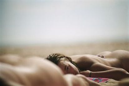 A couple sunbathing in the nude.