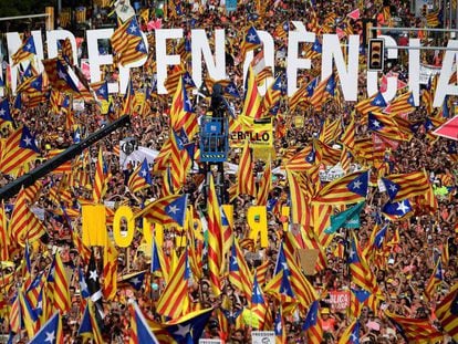 People wave pro-independence flags at the march for the Diada, or National Day of Catalonia, in 2018.