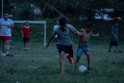 Youths play a soccer game in the Las Margaritas neighborhood. 