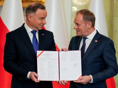 Polish President Andrzej Duda and newly appointed Polish Prime Minister Donald Tusk attend the cabinet swearing-in ceremony at the Presidential Palace in Warsaw, Poland December 13, 2023.