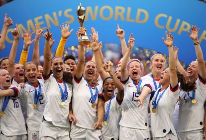 Carli Lloyd lifts the trophy as USA celebrate victory during the 2019 FIFA Women's World Cup final against the Netherlands at Stade de Lyon on July 07, 2019 in Lyon, France. 