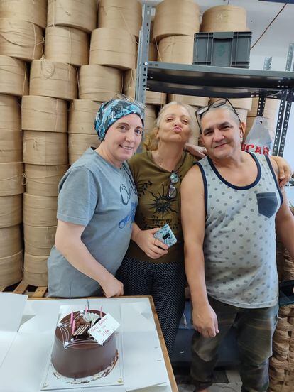 Yudith and Lino with a colleague at the shoe factory where they worked in Turkey.