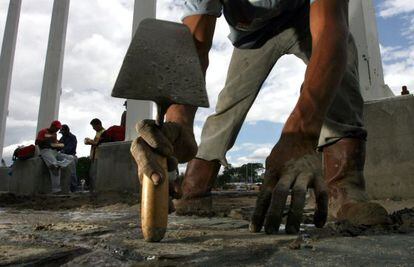 A laborer works outside the Cahamay stadiium in Puerto Ordaz, Venezuela. 