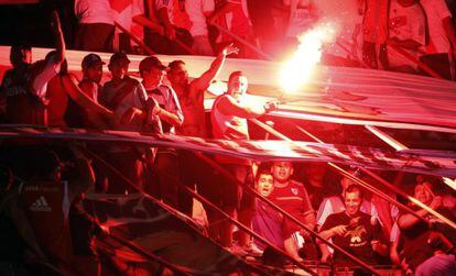 River Plate supporters light flares during a match.