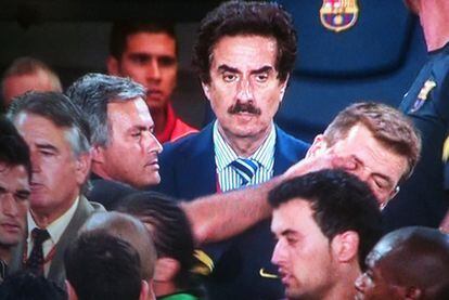 José Mourinho sticks a finger in Tito Vilanova's eye during the Supercup meeting between Barcelona and Real Madrid