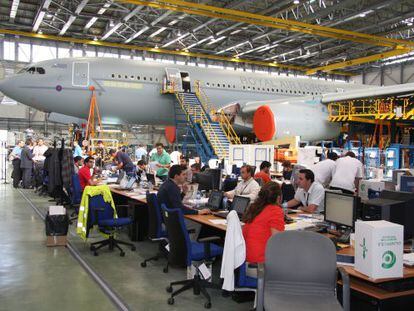 High-flying exports? Engineers work next to an Airbus aircraft at the EADS-CASA installations in Getafe, outside of Madrid.